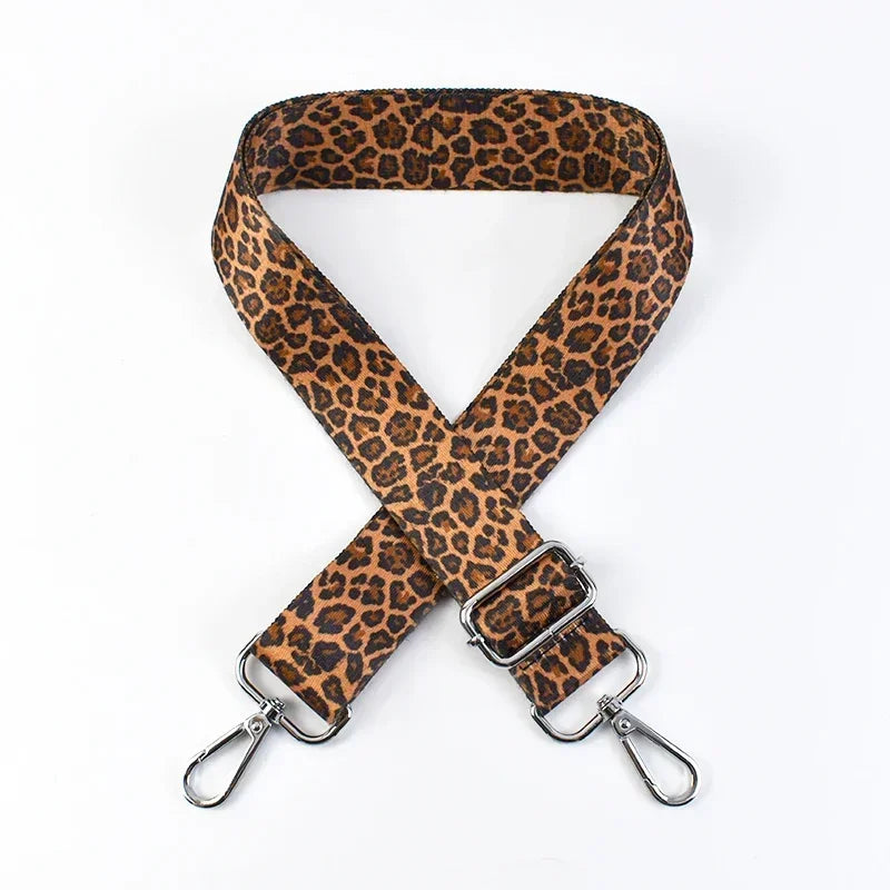 Leopard print phone strap with metal clasps on a white background