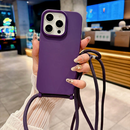 Purple phone case with a strap held by a person in an indoor setting
