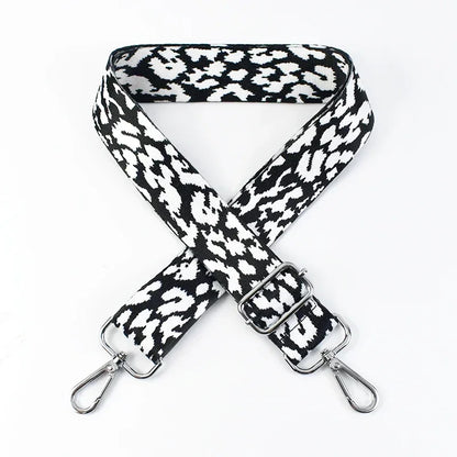 Ocelot patterned bag strap on a white background