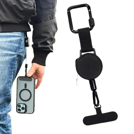 Black retractable phone strap with carabiner clip and universal phone tether on a white background. Person wearing the phone strap with it connected to their jeans. 