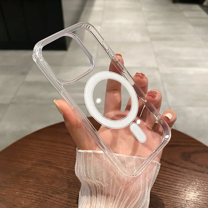 Clear phone case with ring holder held by a hand on a wooden surface.