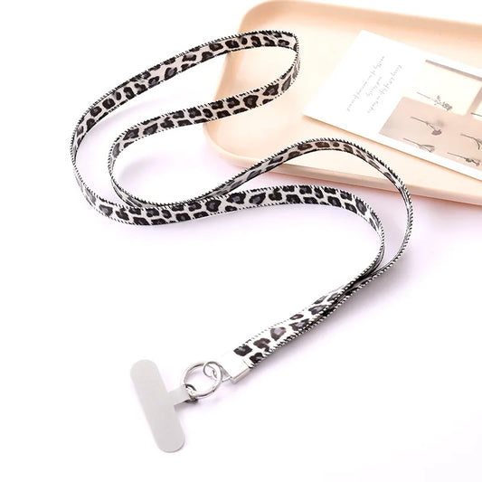 Leopard print lanyard with a white universal phone tether