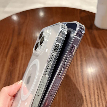Two phone cases being held over a wooden surface