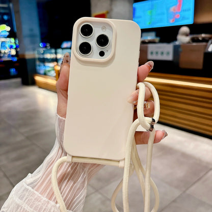 Ivory phone case with a strap held by a person in an indoor setting